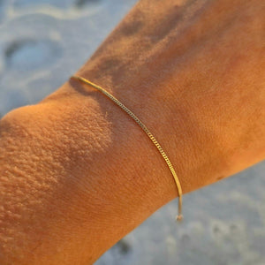 Armband tunn pansar 18k guld 19cm - Smyckesbanken