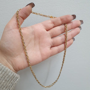 Flätat halsband i tre färgat 18k guld